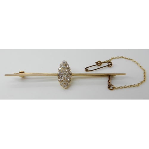 573 - A BAR BROOCH WITH A MARQUIS SHAPED DIAMOND SET CLUSTER