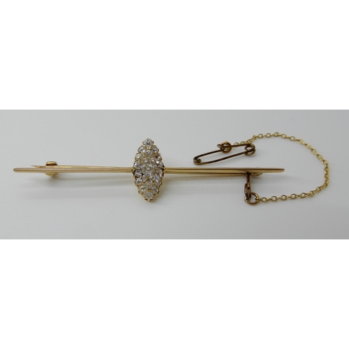 573 - A BAR BROOCH WITH A MARQUIS SHAPED DIAMOND SET CLUSTER