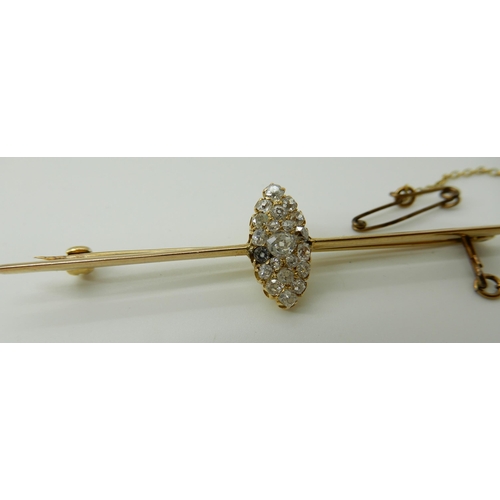 573 - A BAR BROOCH WITH A MARQUIS SHAPED DIAMOND SET CLUSTER