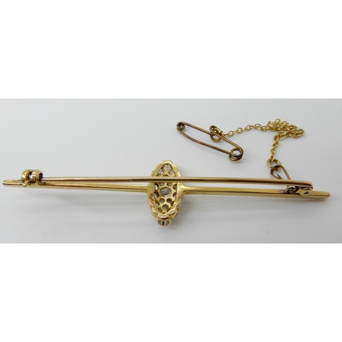 573 - A BAR BROOCH WITH A MARQUIS SHAPED DIAMOND SET CLUSTER