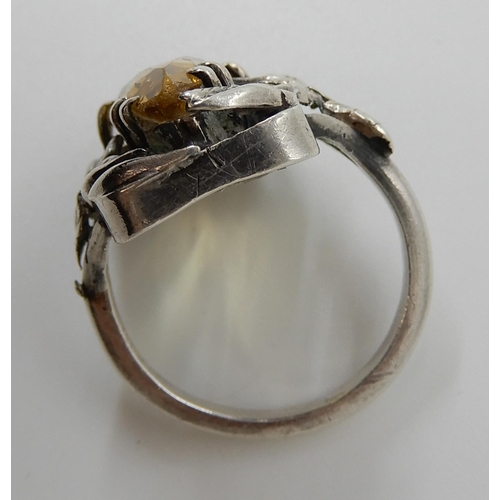 575 - A SILVER CITRINE SET RING IN THE STYLE OF BERNARD INSTONE