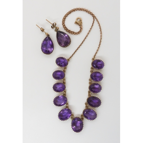 584 - A 9CT AMETHYST FRINGE NECKLACE AND EARRING SET