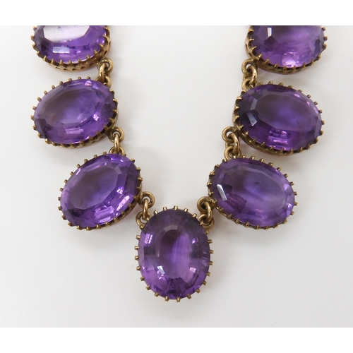 584 - A 9CT AMETHYST FRINGE NECKLACE AND EARRING SET