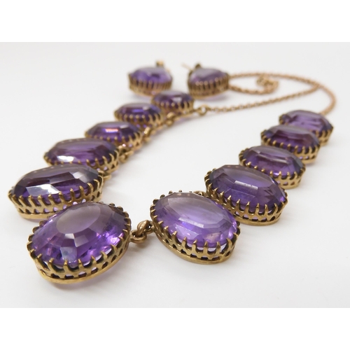 584 - A 9CT AMETHYST FRINGE NECKLACE AND EARRING SET