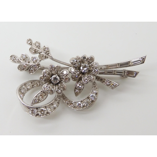 590 - A WHITE METAL FLORAL SPRAY BROOCH