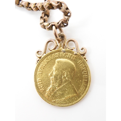 591 - A 9CT GOLD CHAIN WITH FOUR ATTACHED GOLD COINS