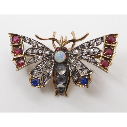 593 - A YELLOW AND WHITE METAL DIAMOND AND GEM SET BUTTERFLY BROOCH