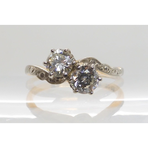 599 - AN 18CT GOLD AND PLATINUM TWIN STONE DIAMOND RING