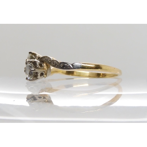 599 - AN 18CT GOLD AND PLATINUM TWIN STONE DIAMOND RING