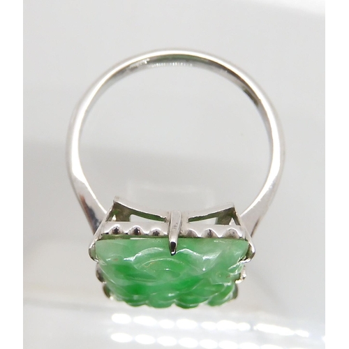 600 - A 9CT WHITE GOLD CHINESE GREEN HARDSTONE RING