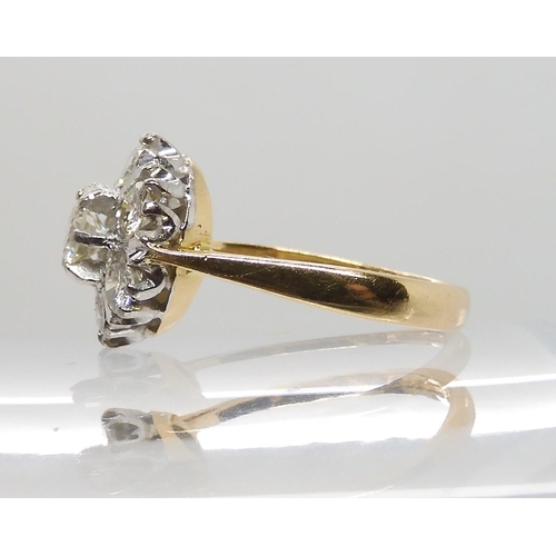 610 - AN 18CT GOLD DIAMOND FLOWER RING