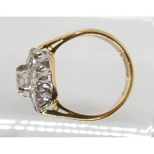 610 - AN 18CT GOLD DIAMOND FLOWER RING