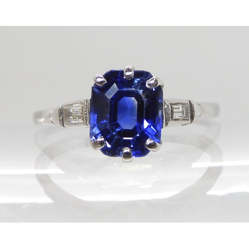 613 - AN 18CT AND PLATINUM SAPPHIRE AND DIAMOND RING