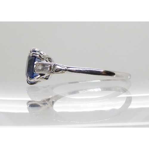 613 - AN 18CT AND PLATINUM SAPPHIRE AND DIAMOND RING