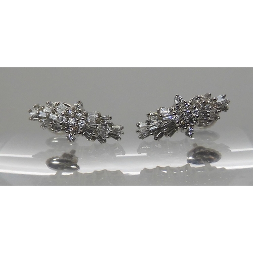 614 - A PAIR OF PLATINUM DIAMOND CLUSTER EARRINGS