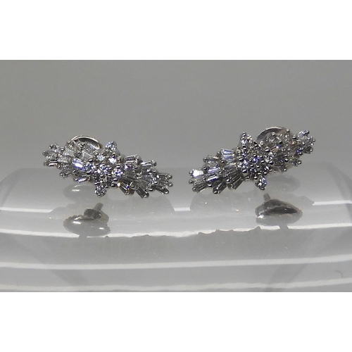 614 - A PAIR OF PLATINUM DIAMOND CLUSTER EARRINGS