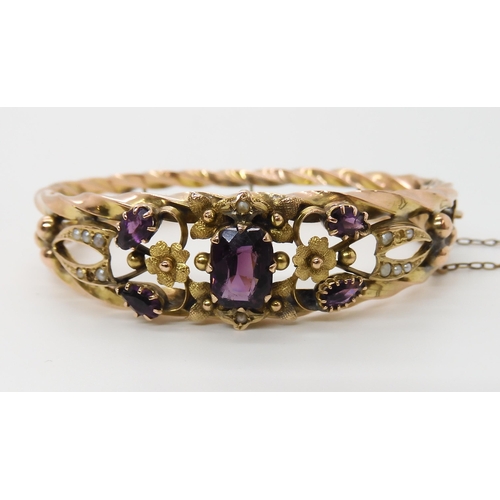 615 - A 9CT GOLD EDWARDIAN GEM SET BANGLE