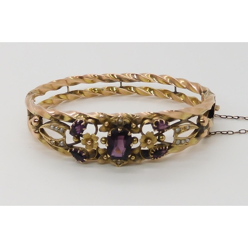 615 - A 9CT GOLD EDWARDIAN GEM SET BANGLE