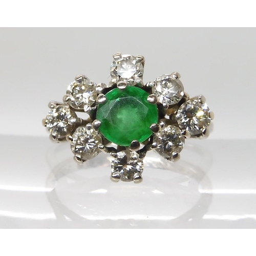 617 - AN 18CT WHITE GOLD EMERALD AND DIAMOND CLUSTER RING