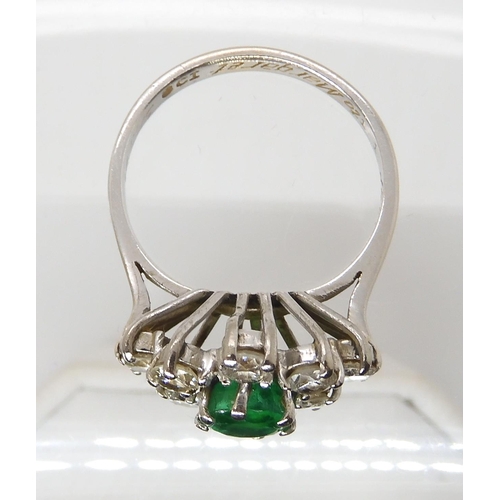 617 - AN 18CT WHITE GOLD EMERALD AND DIAMOND CLUSTER RING