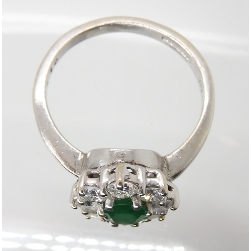 619 - A 9CT WHITE GOLD EMERALD AND DIAMOND CLUSTER RING