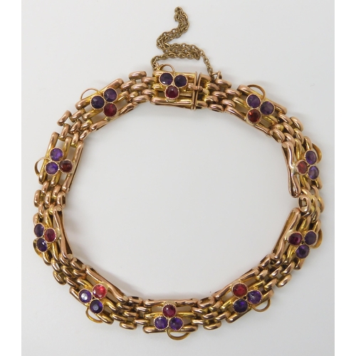 623 - A 9CT GOLD GARNET AND AMETHYST EDWARDIAN BRACELET