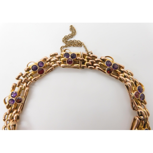 623 - A 9CT GOLD GARNET AND AMETHYST EDWARDIAN BRACELET