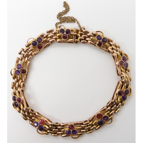 623 - A 9CT GOLD GARNET AND AMETHYST EDWARDIAN BRACELET