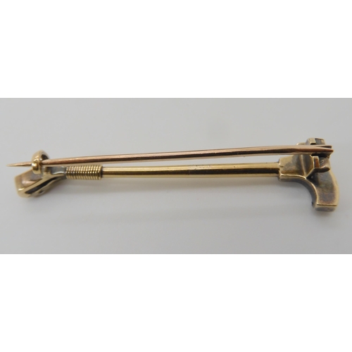 629 - A DIAMOND SET RIDING CROP BROOCH