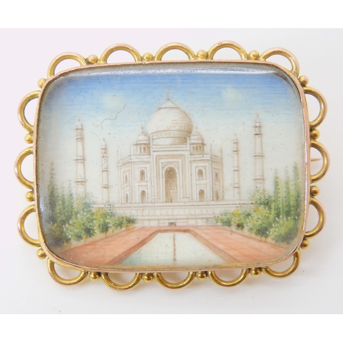 631 - A YELLOW METAL BROOCH MOUNTED MINIATURE OF THE TAJ MAHAL