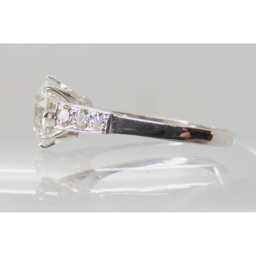 634 - A SUBSTANTIAL PLATINUM AND DIAMOND RING