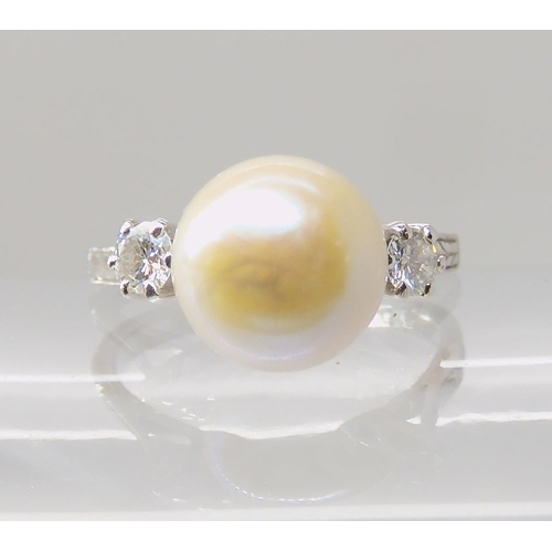 635 - AN 18CT WHITE GOLD PEARL AND DIAMOND RING