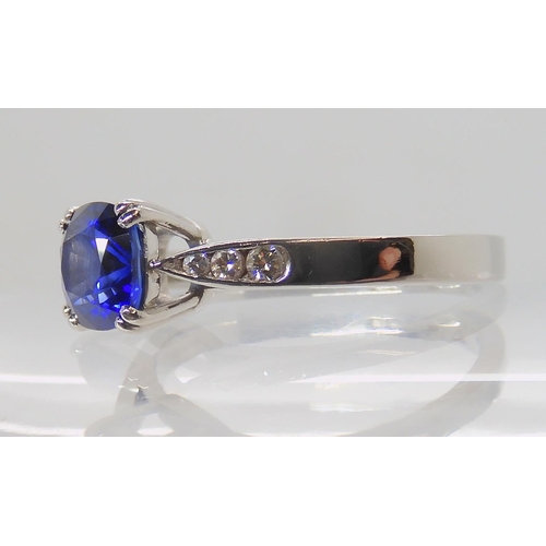 638 - A PLATINUM SAPPHIRE AND DIAMOND RING