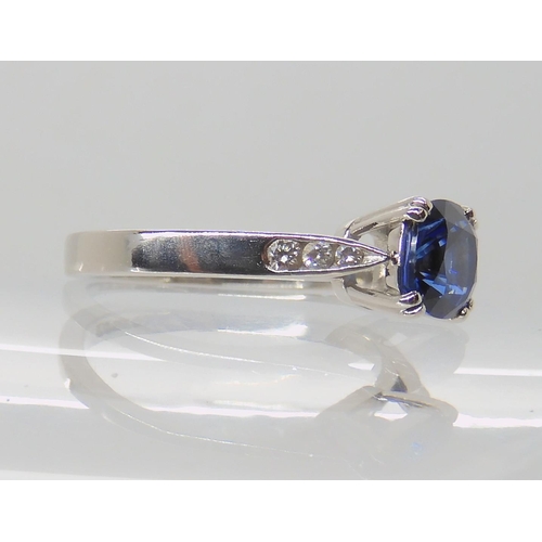 638 - A PLATINUM SAPPHIRE AND DIAMOND RING