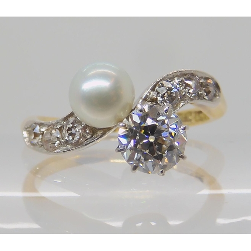 640 - AN 18CT DIAMOND AND PEARL RING