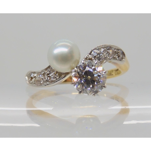 640 - AN 18CT DIAMOND AND PEARL RING