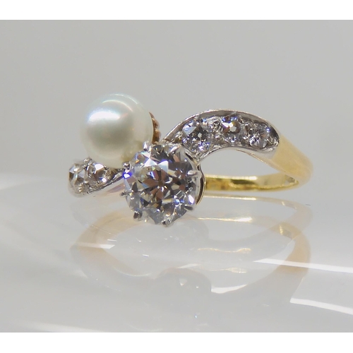 640 - AN 18CT DIAMOND AND PEARL RING