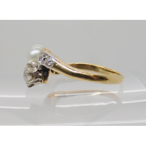 640 - AN 18CT DIAMOND AND PEARL RING