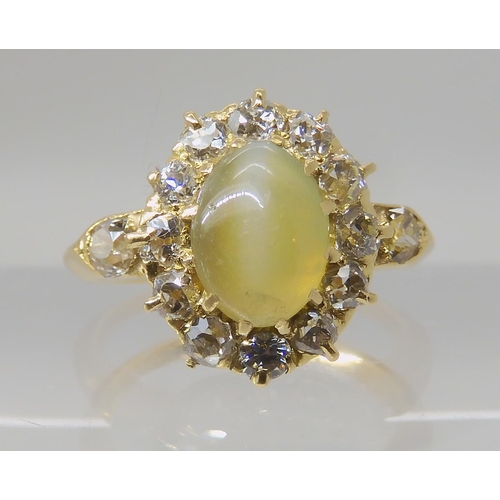 641 - A CHRYSOBERYL AND OLD CUT DIAMOND CLUSTER RING