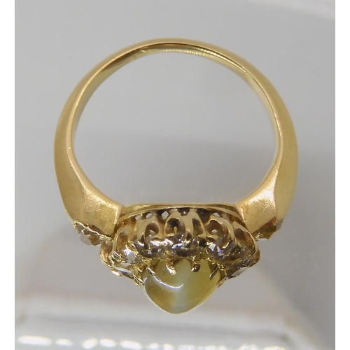 641 - A CHRYSOBERYL AND OLD CUT DIAMOND CLUSTER RING