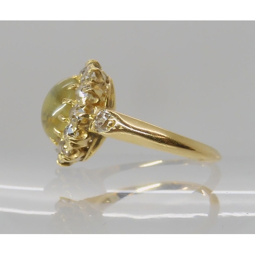 641 - A CHRYSOBERYL AND OLD CUT DIAMOND CLUSTER RING