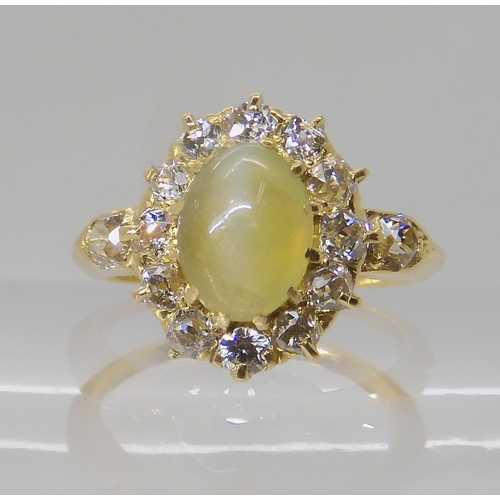 641 - A CHRYSOBERYL AND OLD CUT DIAMOND CLUSTER RING