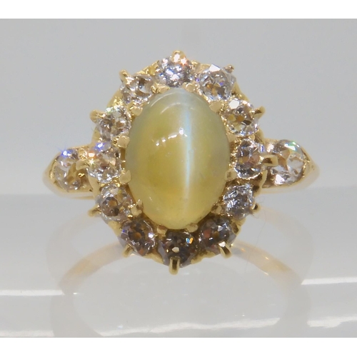 641 - A CHRYSOBERYL AND OLD CUT DIAMOND CLUSTER RING