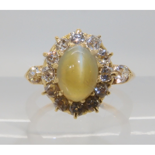 641 - A CHRYSOBERYL AND OLD CUT DIAMOND CLUSTER RING