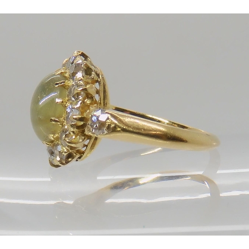 641 - A CHRYSOBERYL AND OLD CUT DIAMOND CLUSTER RING