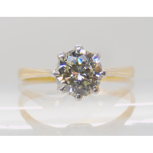 642 - AN 18CT GOLD AND PLATINUM SOLITAIRE DIAMOND RING