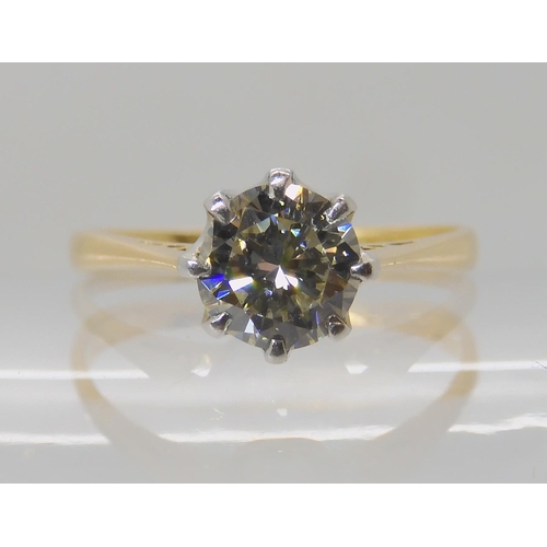 642 - AN 18CT GOLD AND PLATINUM SOLITAIRE DIAMOND RING