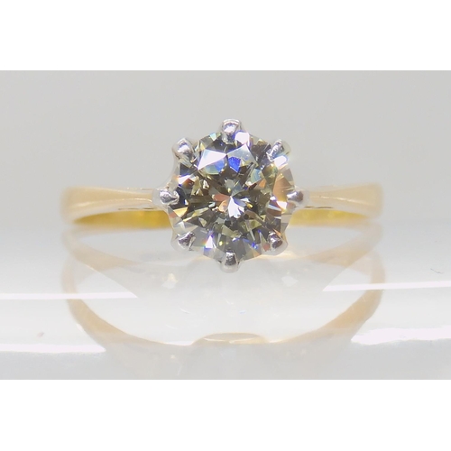 642 - AN 18CT GOLD AND PLATINUM SOLITAIRE DIAMOND RING