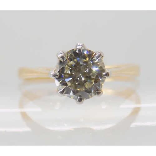 642 - AN 18CT GOLD AND PLATINUM SOLITAIRE DIAMOND RING