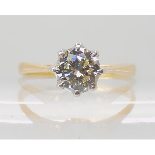 642 - AN 18CT GOLD AND PLATINUM SOLITAIRE DIAMOND RING